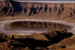 A salty lake lies at the bottom of Wahba crater