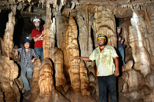Cavers admiring the many stalactites and columns of Cueva de los Monos, Jalisco, Mexico.