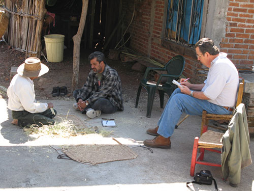 Eduardo Williams (right) interviewing an informant in a basket-making workshop