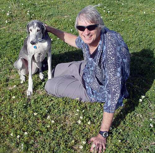Author Greg Gregory with Sabrina the Saluki, in the wild flowers